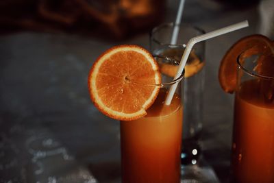 Close-up of orange juice on table