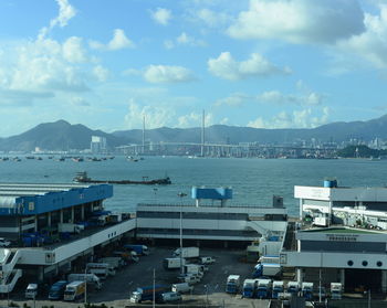 High angle view of harbor against cloudy sky