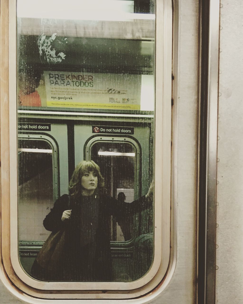 train - vehicle, window, public transportation, transportation, real people, subway train, one person, lifestyles, indoors, portrait, day, technology, young adult, people