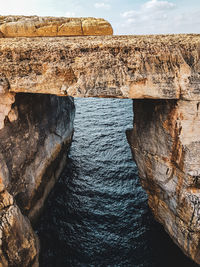 View of rock formation in sea