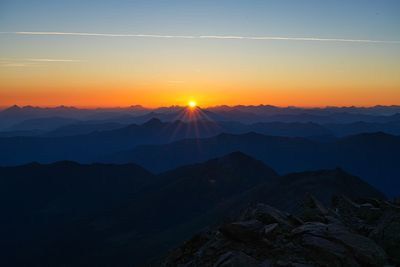 Scenic view of mountains against sky during sunset