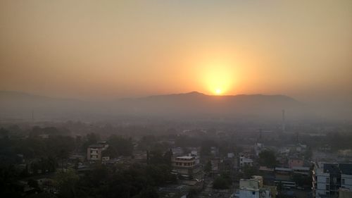 High angle view of city at sunset