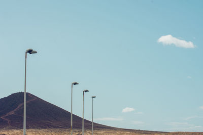 Low angle view of street light against sky