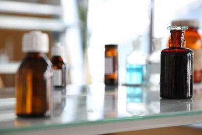 Close-up of bottles on table at home