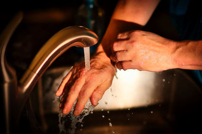 Close-up of hands cleaning hands