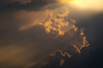 Low angle view of clouds in sky during sunset