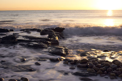 Scenic view of sea during sunset