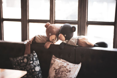 Stuffed toy on sofa at home