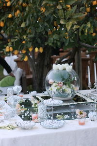 Wedding table with favors and confetti.