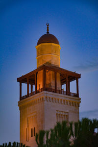 Low angle view of building against blue sky