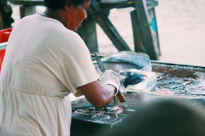 Man working at fish