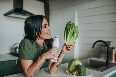 Woman holding food at home