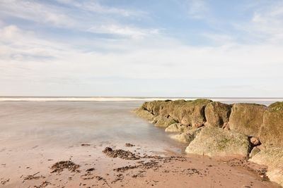 Scenic view of beach against sky