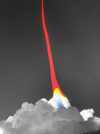 Low angle view of smoke against black background