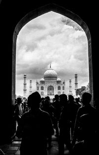 People in city against sky