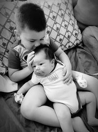 Mother and baby girl sitting on floor