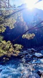 Scenic view of waterfall against sky during winter