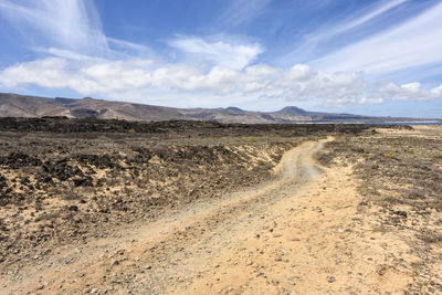 Scenic view of desert against sky