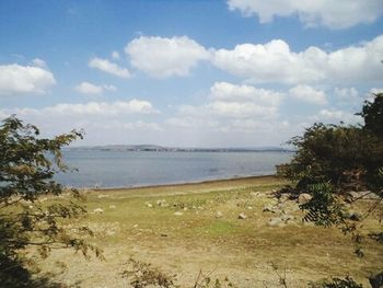 Scenic view of sea against cloudy sky