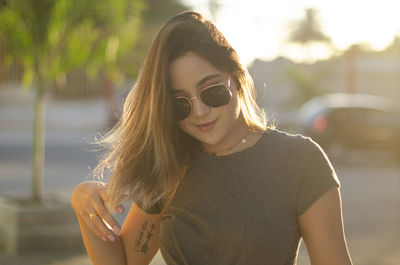 Portrait of young woman wearing sunglasses