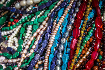 Close-up of multi colored jewelry for sale in market