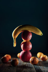 High angle view of apple on table against black background