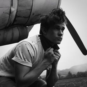 Portrait of young man looking away