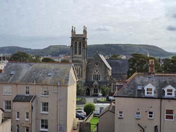 Buildings in city against sky