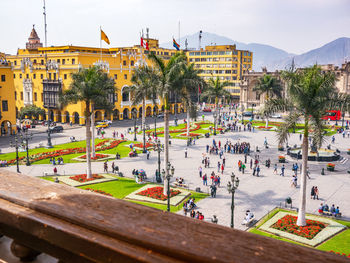 High angle view of people on street against buildings in city