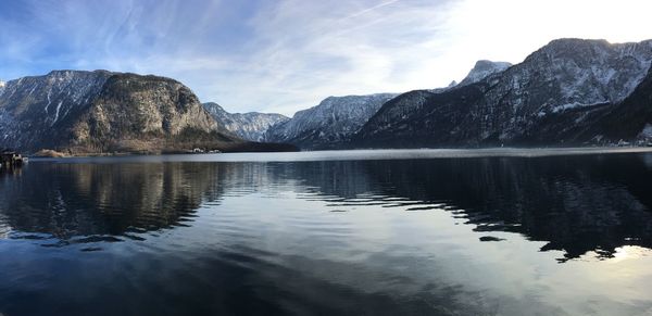 Scenic view of lake and mountains against sky