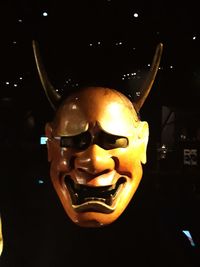 Close-up of human skull against black background