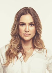 Portrait of a beautiful young woman over white background