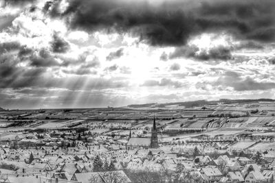 Scenic view of landscape against cloudy sky