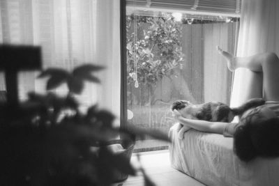 Young woman with cat at home