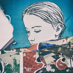 Woman with graffiti on wall