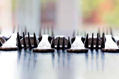 Close-up of forks on table