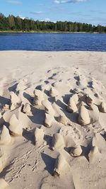 High angle view of sand on beach against sky