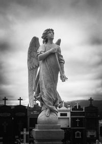 Low angle view of statue against sky