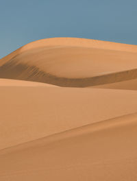 Scenic view of desert against clear sky