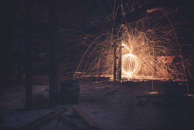 Illuminated wire wheel against at night