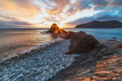 Scenic view of sea against sky during sunset