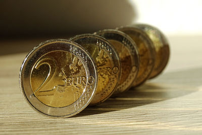 Extreme close-up of coins on table