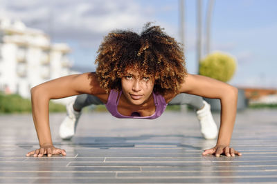 Portrait of young woman exercising outdoors
