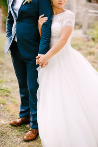 Front view of couple holding hands