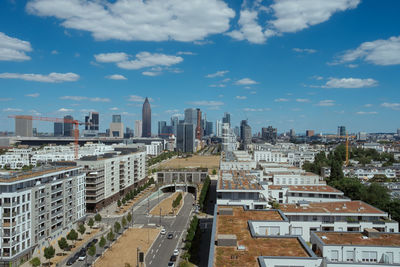 Buildings in city against sky