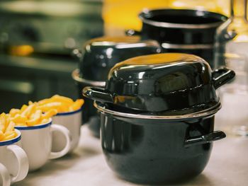 Close-up of kitchen utensils on table