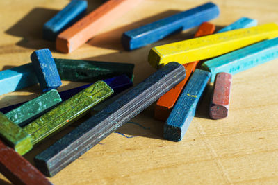 Close-up of multi colored crayons on table