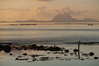 Scenic view of sea against sky at sunset