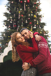 Young woman with christmas tree