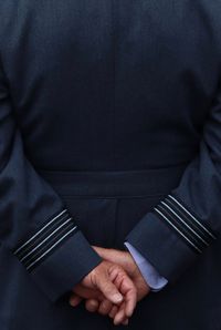 Rear view of man wearing uniform